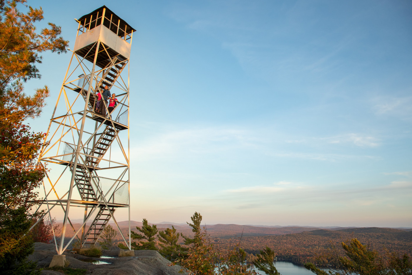 A fire tower stands out on a mountain summit