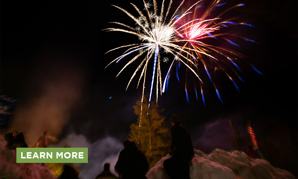 Fireworks in the winter night sky with a Learn More button.